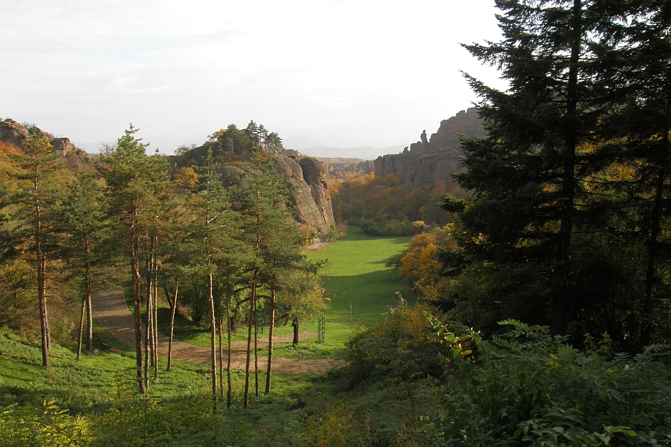 Grassy Valley Between Rocky Cliffs