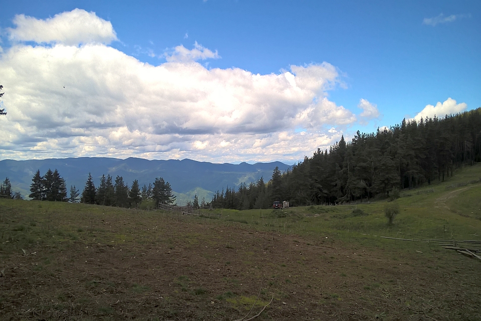 Mountainous Landscape Under A Partly Cloudy Sky