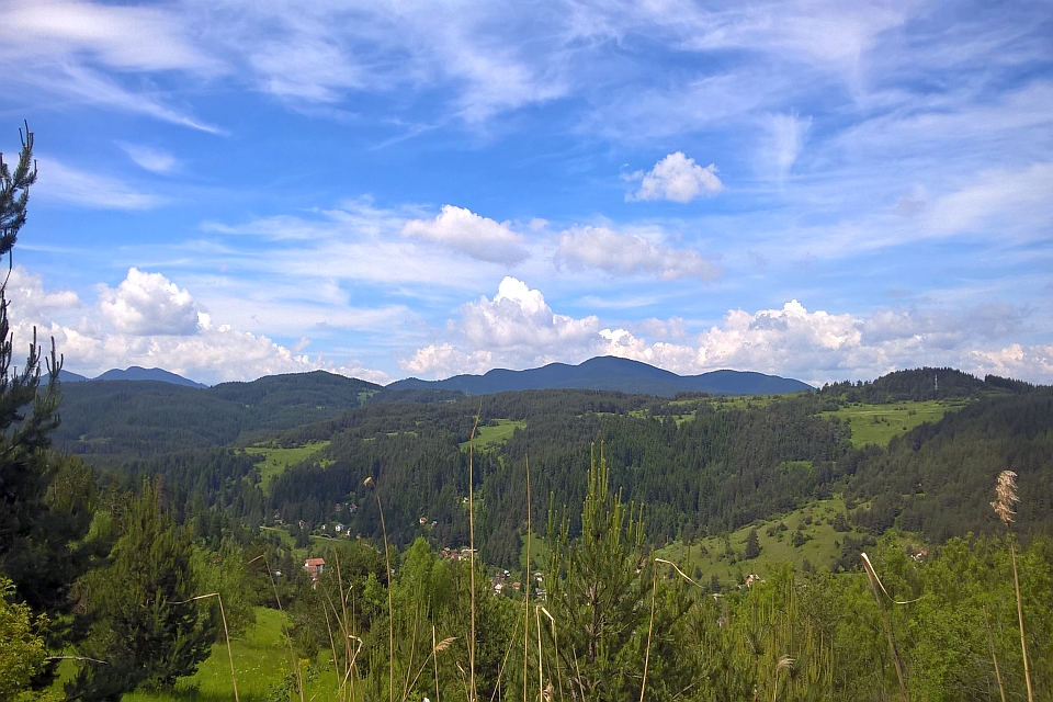 Mountain Range Under A Partly Cloudy Sky