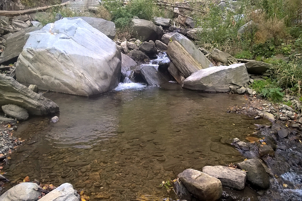 Small Waterfall Cascading Over Rocks