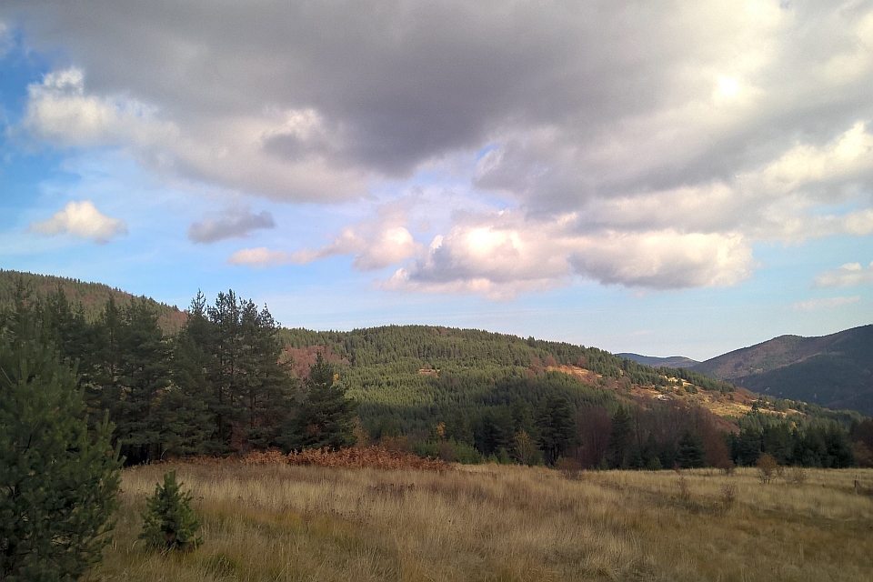 Partly Cloudy Sky Over A Mountainous Landscape