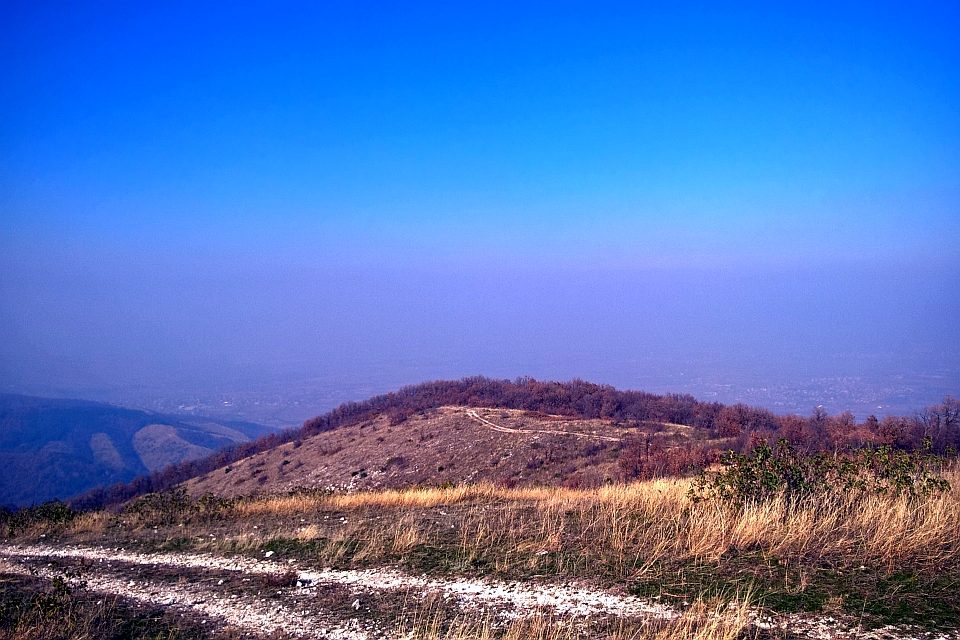 Dirt Road Leads To A Treeless Hilltop