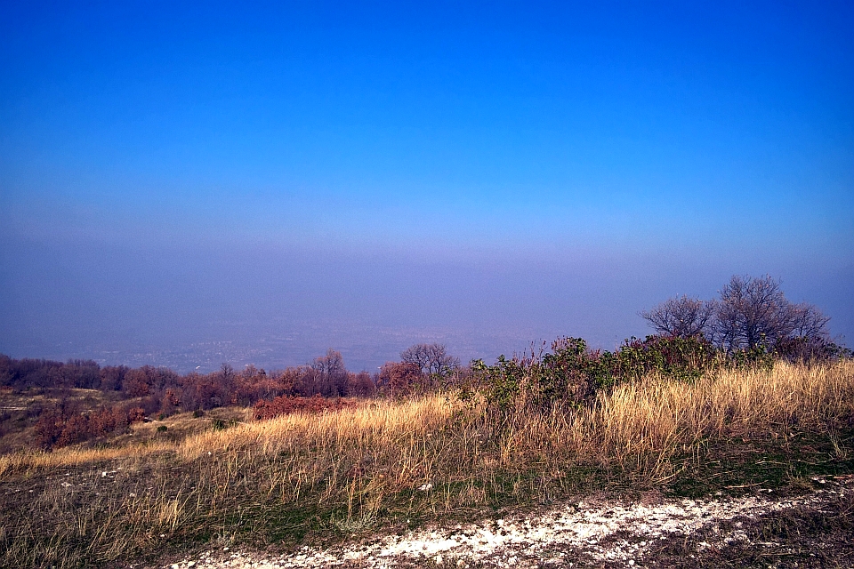 Hazy Valley Below A Hilltop