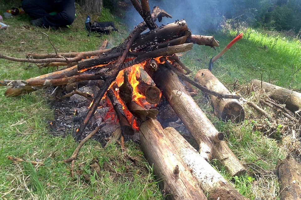 Bonfire Burns Brightly Amidst Tall Grass