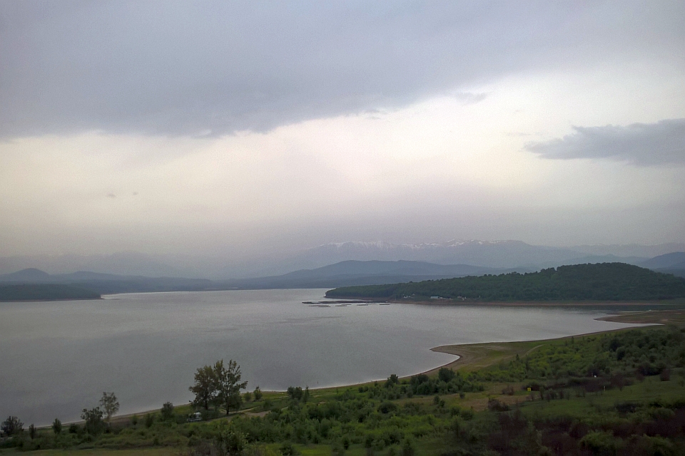 Calm Lake Nestled In A Valley