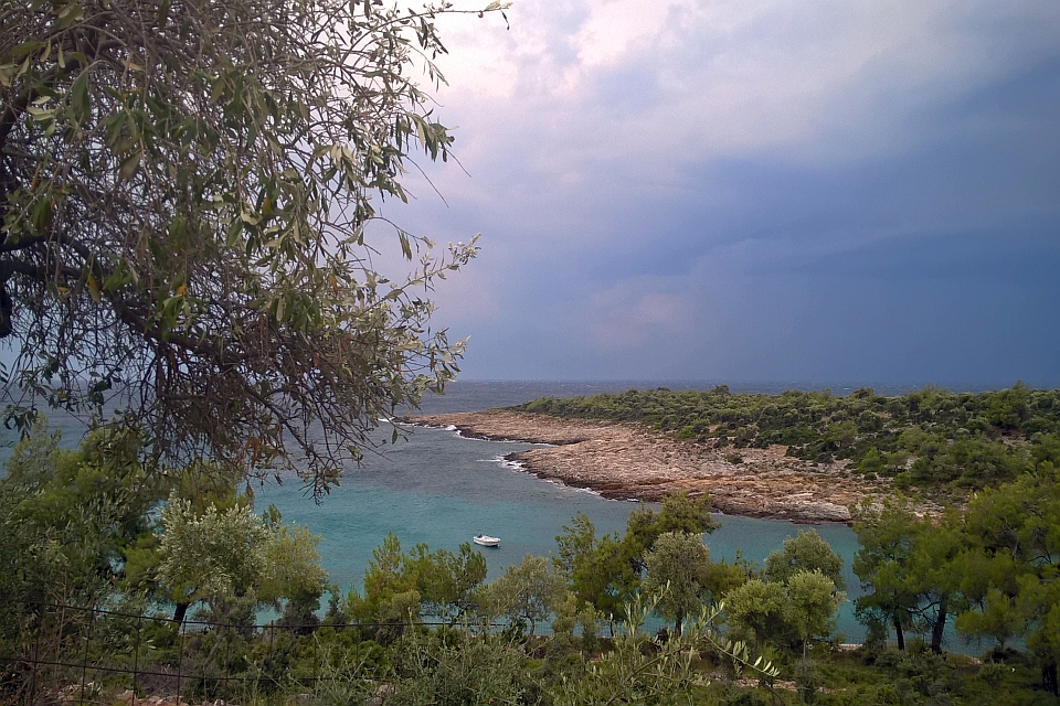 A Tranquil Cove With A Small Boat