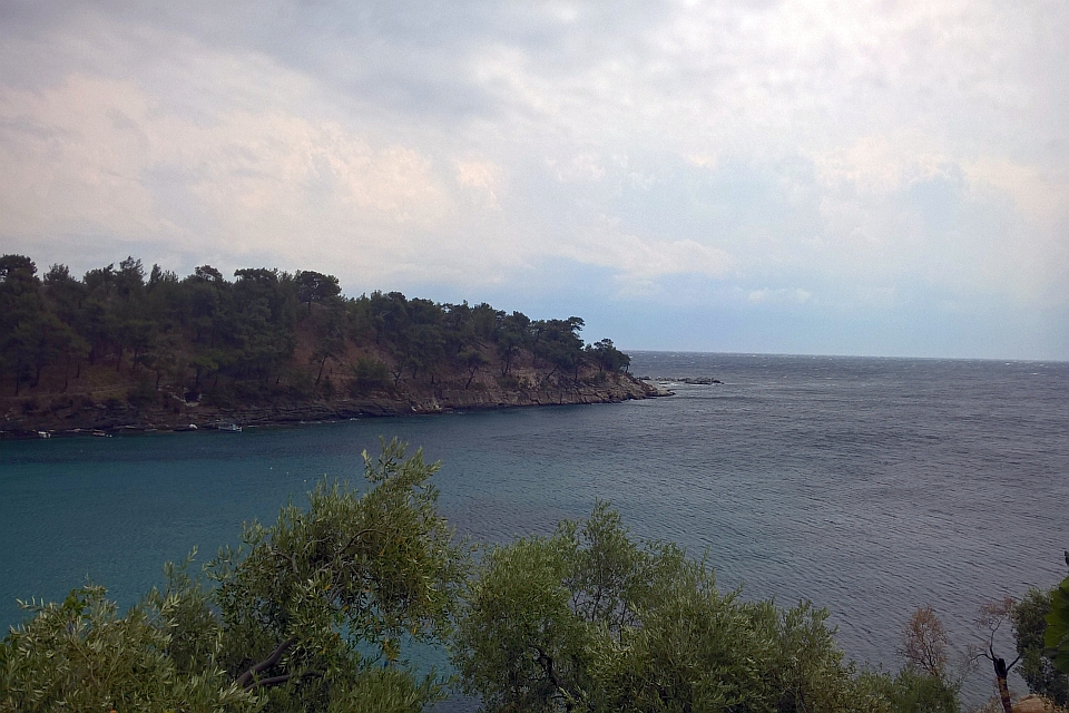 Tranquil Cove With Dark Teal Water