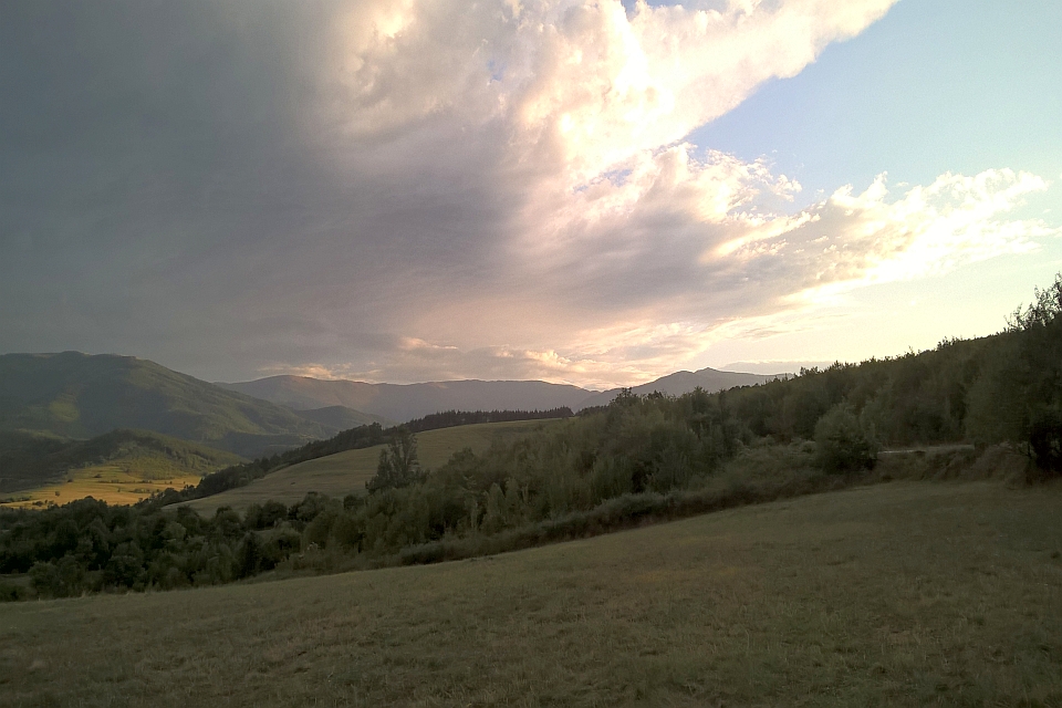 Sunset Over Rolling Hills And Fields