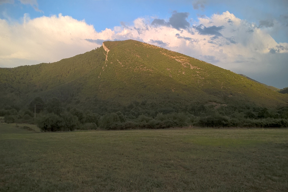 Green Mountain Under A Partly Cloudy Sky