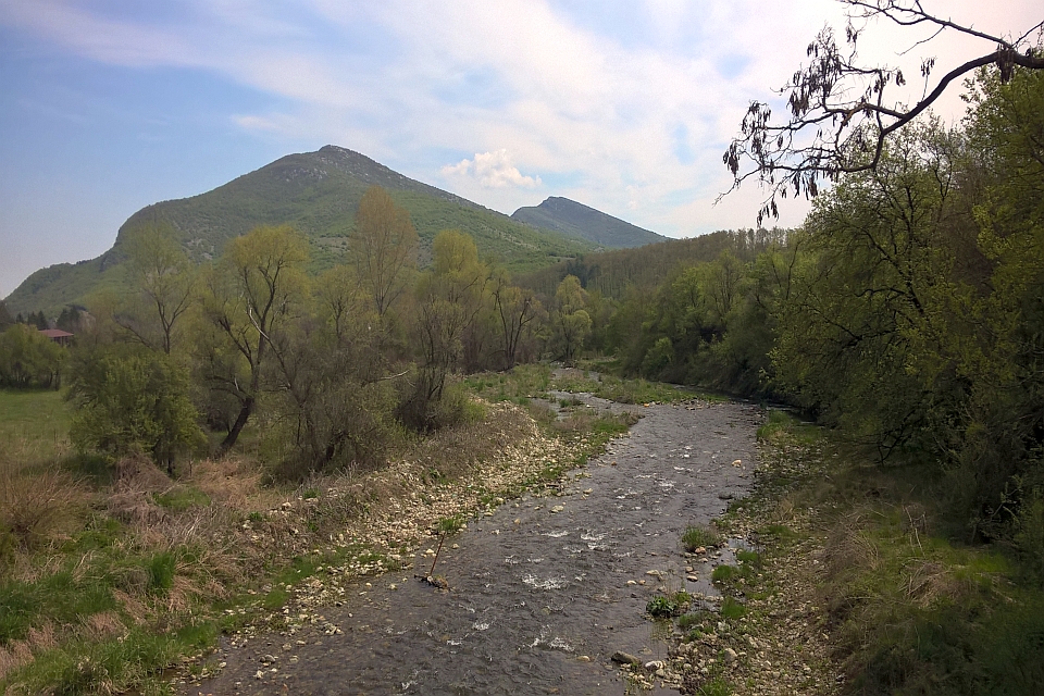 Rocky River Flows Through A Valley