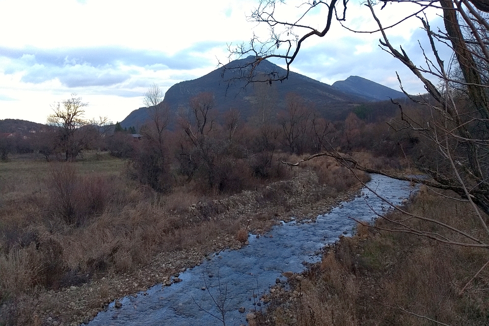 Stream Flows Through A Valley