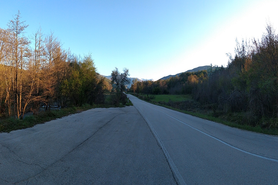 Paved Road Winds Through A Valley