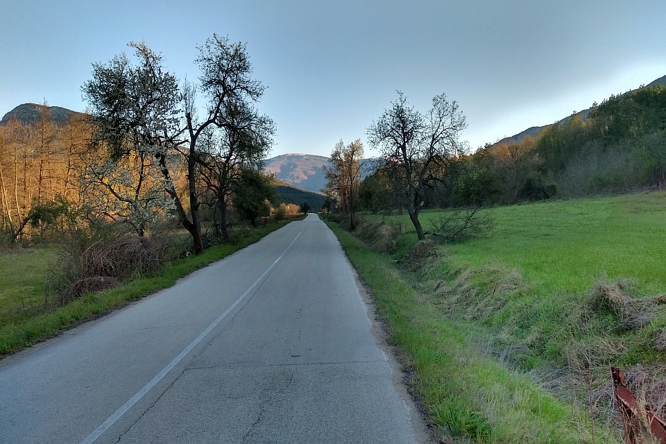 Paved Road Winds Through A Valley