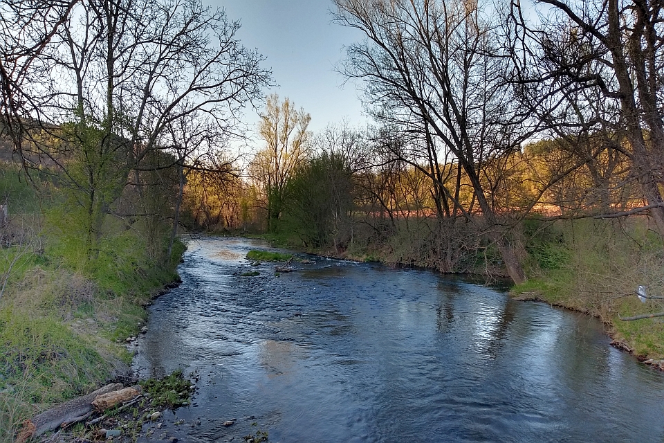 Tranquil River Flows Through A Landscape