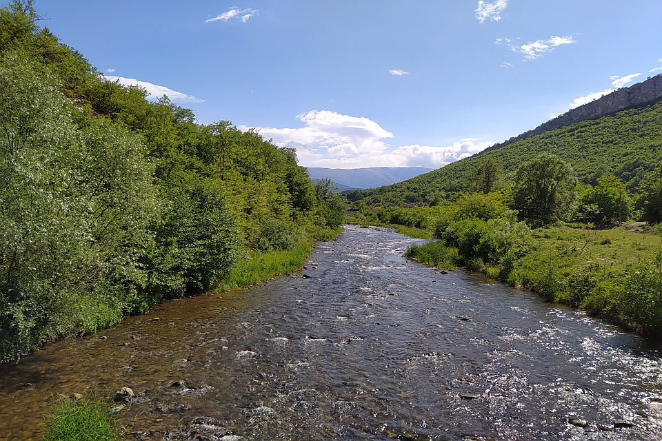 River Flows Through A Valley